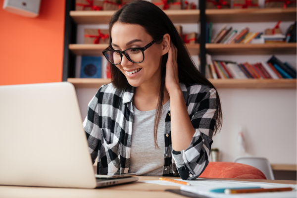 woman looking at laptop