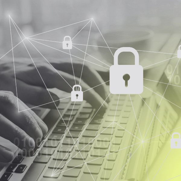 person typing on computer with padlock in the forefront