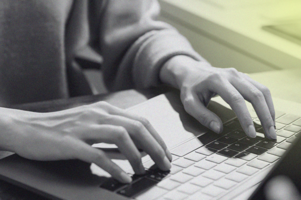 person typing on laptop